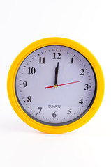 Yellow clock alarm isolated on white background