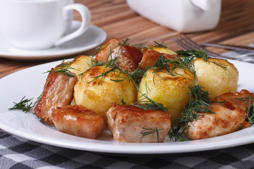 new potatoes with dill and fried slices pork