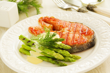 Grilled salmon steak with asparagus.