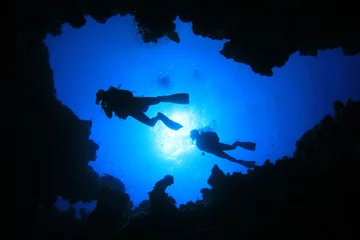 Fotobehang Scuba Divers swim over underwater cave © Richard Carey