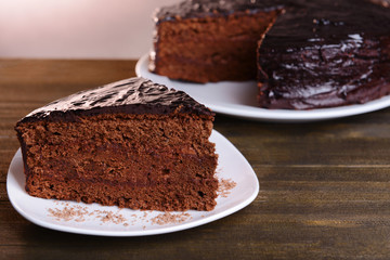 Delicious chocolate cake on table close-up