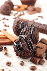 Delicious chocolates on table close-up