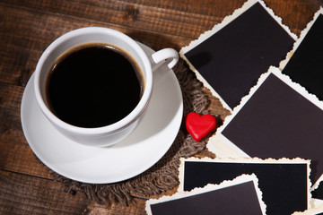 Composition with coffee cup, decorative hearts and old blank