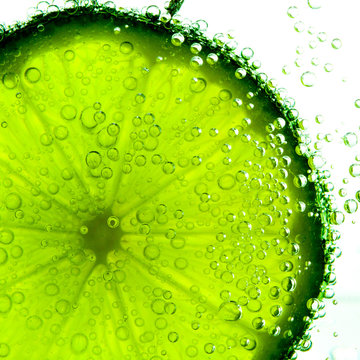 lime with bubbles isolated on white
