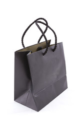 isolated of the black paper bag for shopping on a white backgrou