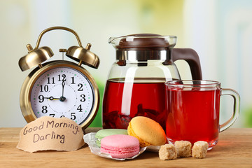 Tasty herbal tea and cookies on wooden table