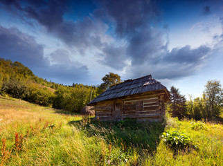 Old house in the mountains in summer