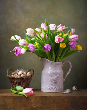 Still life with colorful tulips and quail tulips