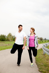 Couple stretching before running