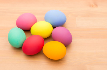 Painted easter egg over wooden texture