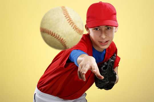 portrait of a beautiful teen baseball player in red and white un