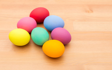 Colourful easter egg over wooden background