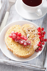 french toast with redcurrant and powder sugar for breakfast