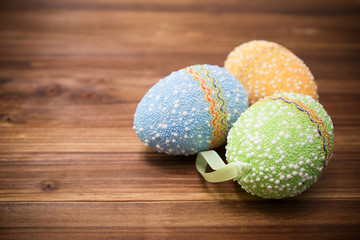 Easter eggs on wooden background