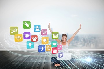Cheering blonde using laptop with app icons