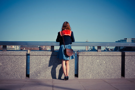Young woman admiring London skyline