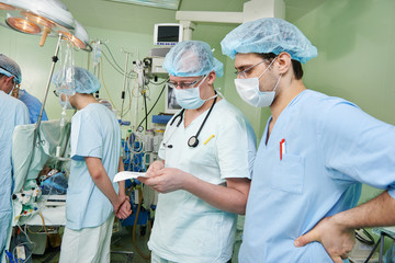 two anaesthesiologist doctors at cardiac operation
