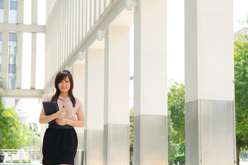 young asian business woman with office background