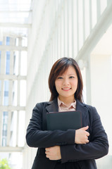 young asian business woman with office background