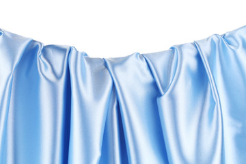 Close up of blue silk fabric background.
