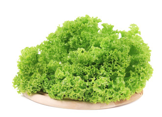 Fresh lettuce on wooden platter.