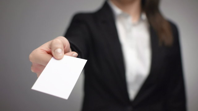 businesswoman giving a business card