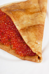 Pancake with red caviar
