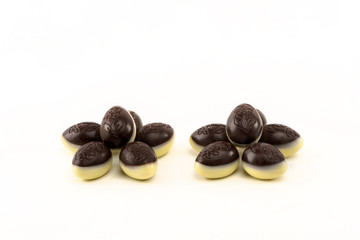 Candy easter eggs made of white and dark chocolate. Isolated on