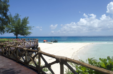Beach and boat on turquoise water in Zanzibar, Tanzania, Africa