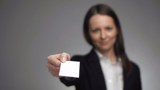 businesswoman giving a business card