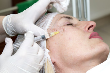 Cosmetic treatment with botox injection in a clinic