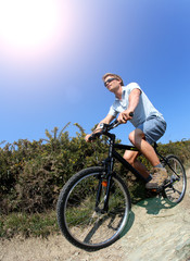 Fototapeta na wymiar Man riding bike on a country pathway