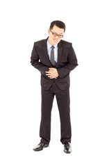 Obraz na płótnie Canvas Businessman holding his stomach in pain