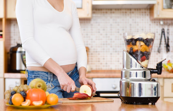 Pregnancy And Nutrition - Pregnant Woman With Fruits