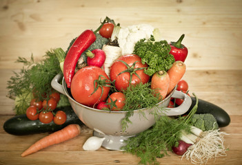 Fresh vegetables in metal colander
