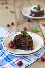 Chocolate fondant lava cake with cranberry and mint