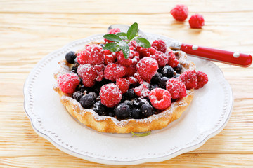 tartlet with fresh raspberries and currants