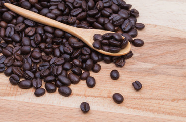 Coffee beans on grunge wooden background