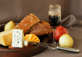 Still-life with cheese and a glass of wine