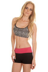 Fototapeta premium woman fitness pink black shorts stand serious