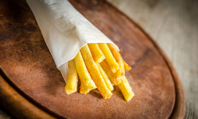 French fries in a paper wrapper