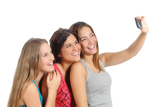Group of teenager girls photographing with smart phone camera