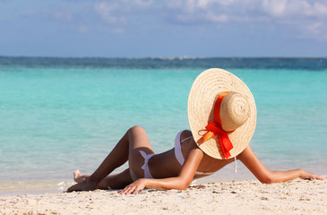 Fototapeta na wymiar Sexy girl on tropical beach. Vacation