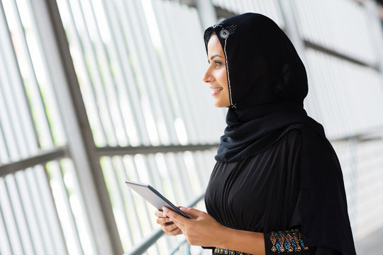 muslim woman with tablet computer