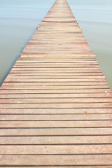 Wooden bridge into the sea