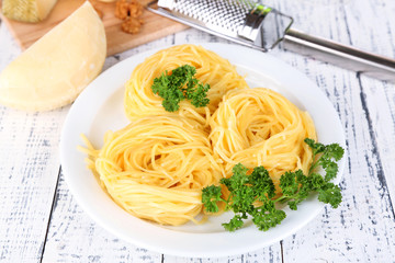 Composition with tasty spaghetti, grater, cheese,