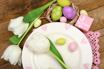 Easter table setting with tulips and eggs