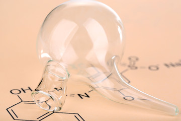 Test tube and reaction formula, close-up