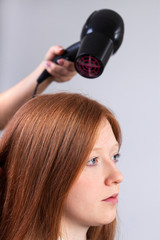 Naklejka premium Hair styling in beauty salon