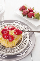 pastry cake with strawberries and pudding